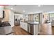 Modern kitchen featuring an island, stainless steel appliances, granite countertops, and ample cabinet space at 1344 Secrest Commons Ct, Monroe, NC 28112