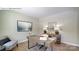 Well-lit home office with sleek desk, chair, wood floors, gray walls, and minimalist decor at 1353 Secrest Commons Dr, Monroe, NC 28112