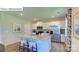 Modern kitchen featuring white cabinets, granite countertops, stainless steel appliances, and a central island with stool seating at 1353 Secrest Commons Dr, Monroe, NC 28112