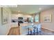 Modern kitchen with white cabinets, stainless steel appliances, granite countertops, a center island and bar stool seating at 1353 Secrest Commons Dr, Monroe, NC 28112
