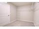 Walk-in closet with wire shelving and neutral carpeting providing ample storage space at 1353 Secrest Commons Dr, Monroe, NC 28112