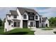 Magnificent two-story home with modern architecture, black windows, and a beautifully maintained front lawn at 13820 E Rocky River Rd, Davidson, NC 28036