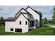 A luxurious two-story home with a walk out basement and a large yard at 13820 E Rocky River Rd, Davidson, NC 28036