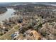 Aerial view of a lakeside community showcasing waterfront properties and natural surroundings at 140 Swimmers Ln, Salisbury, NC 28146