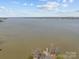 Scenic aerial view of the lake and surrounding landscape, showcasing the area's natural beauty at 140 Swimmers Ln, Salisbury, NC 28146