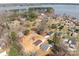 A beautiful aerial view of the home near a tranquil lake and surrounding lush greenery creating a serene setting at 140 Swimmers Ln, Salisbury, NC 28146