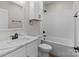 Modern bathroom featuring a white vanity, updated fixtures, and a bathtub with white tile surround at 140 Swimmers Ln, Salisbury, NC 28146