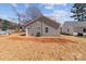 Exterior view of a newly constructed home with vinyl siding and a spacious backyard at 140 Swimmers Ln, Salisbury, NC 28146