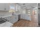 Modern kitchen with stainless steel appliances, stylish lighting and countertops with an island for extra space at 140 Swimmers Ln, Salisbury, NC 28146