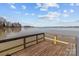 Picturesque view of the lake from a wooden dock, offering serene waterfront living at 140 Swimmers Ln, Salisbury, NC 28146
