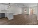 Bright living area with hardwood floors, white walls, and open access to the kitchen at 140 Swimmers Ln, Salisbury, NC 28146