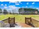 Spacious backyard with lush greenery and mature trees, perfect for outdoor activities at 1429 Scotts Creek Rd, Statesville, NC 28625