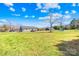 Vast backyard offering ample green space and mature trees, perfect for recreation and relaxation at 1429 Scotts Creek Rd, Statesville, NC 28625
