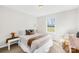 Bright bedroom featuring a plush bed, neutral tones, and a view to the outdoors at 1429 Scotts Creek Rd, Statesville, NC 28625