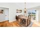 Dining area featuring hardwood floors, stylish lighting, and a view to the backyard at 1429 Scotts Creek Rd, Statesville, NC 28625