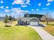 Charming single-story home with manicured lawn and mature trees creating an inviting curb appeal at 1429 Scotts Creek Rd, Statesville, NC 28625