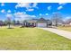 Charming single-story home featuring stone accents, a two-car garage, and a beautifully manicured lawn at 1429 Scotts Creek Rd, Statesville, NC 28625