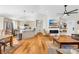 Open living room featuring fireplace, vaulted ceiling and access to the kitchen and dining area at 1429 Scotts Creek Rd, Statesville, NC 28625