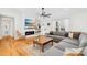 Bright living room with hardwood floors, modern fireplace, and a comfortable sectional sofa at 1429 Scotts Creek Rd, Statesville, NC 28625