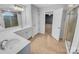 Clean bathroom featuring dual vanities, white cabinets, and a glass shower at 151 Slip Shot Ln, Troutman, NC 28166