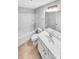 Pristine bathroom with a tub-shower combo, toilet, and vanity with modern fixtures and ample lighting at 151 Slip Shot Ln, Troutman, NC 28166