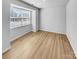 Clean, empty bedroom featuring hardwood floors and natural light at 151 Slip Shot Ln, Troutman, NC 28166