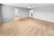 Large bedroom with an open layout, and a view of the en-suite bathroom and stairs at 151 Slip Shot Ln, Troutman, NC 28166