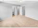 Open bedroom with neutral carpet, light gray walls, and an ensuite bath, perfect for relaxation at 151 Slip Shot Ln, Troutman, NC 28166