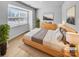 Staged bedroom featuring neutral decor, hardwood floors, and a large window at 151 Slip Shot Ln, Troutman, NC 28166