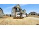 Two-story home featuring a mix of gray siding and brick accents, complemented by a well-manicured lawn at 151 Slip Shot Ln, Troutman, NC 28166