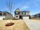 Two-story house showcasing a mix of gray siding and brick accents, with a two-car garage at 151 Slip Shot Ln, Troutman, NC 28166
