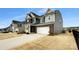 Charming two-story home with a two-car garage and well-maintained landscaping at 151 Slip Shot Ln, Troutman, NC 28166