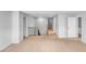 Open hallway with wood and iron railing, neutral carpet, and many entryways to rooms at 151 Slip Shot Ln, Troutman, NC 28166