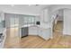 Modern kitchen featuring stainless steel appliances, a breakfast bar, and ample cabinet space at 151 Slip Shot Ln, Troutman, NC 28166