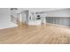 Open-concept living space with modern flooring connecting the living and kitchen areas at 151 Slip Shot Ln, Troutman, NC 28166