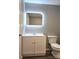 A modern bathroom featuring a new vanity, sleek illuminated mirror, and new toilet at 1607 W Nc 27 Hwy, Lincolnton, NC 28092