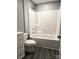 This bathroom is complete with a vanity, toilet, and a shower-tub combination at 1607 W Nc 27 Hwy, Lincolnton, NC 28092