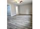 A spacious bedroom featuring durable flooring, neutral paint, and a modern ceiling fan at 1607 W Nc 27 Hwy, Lincolnton, NC 28092