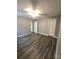 A bright bedroom featuring durable flooring, neutral paint, and an airy feel at 1607 W Nc 27 Hwy, Lincolnton, NC 28092