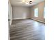 A bright bedroom featuring durable flooring, neutral paint, and a modern ceiling fan at 1607 W Nc 27 Hwy, Lincolnton, NC 28092