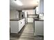 Open-concept kitchen with a kitchen island, stainless steel appliances, granite counters, and modern cabinetry at 1607 W Nc 27 Hwy, Lincolnton, NC 28092