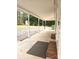 This covered porch features brick accents, a concrete floor, and a lovely forest view at 1607 W Nc 27 Hwy, Lincolnton, NC 28092