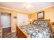 Cozy bedroom with a ceiling fan, light wood flooring and three door closet at 1636 Samaria Ln, Conover, NC 28613