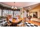 Dining room showing a dining table, bay window, hardwood flooring and black and white checkerboard accent at 1636 Samaria Ln, Conover, NC 28613