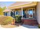 Inviting front porch with brick steps and charming decor on a sunny day at 1636 Samaria Ln, Conover, NC 28613