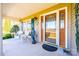 Charming front porch with seating area and decorative, ornate front door at 1636 Samaria Ln, Conover, NC 28613