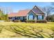 Inviting one-story home featuring lush landscaping and a well-maintained lawn at 1636 Samaria Ln, Conover, NC 28613
