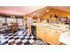Open kitchen with granite countertops and black-and-white checkered floors at 1636 Samaria Ln, Conover, NC 28613