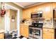 Updated kitchen with stainless steel appliances and tile backsplash at 1636 Samaria Ln, Conover, NC 28613