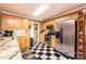Modern kitchen featuring stainless steel appliances and black and white floors at 1636 Samaria Ln, Conover, NC 28613